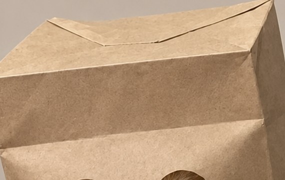 Close-up of the folded kraft paper bag texture